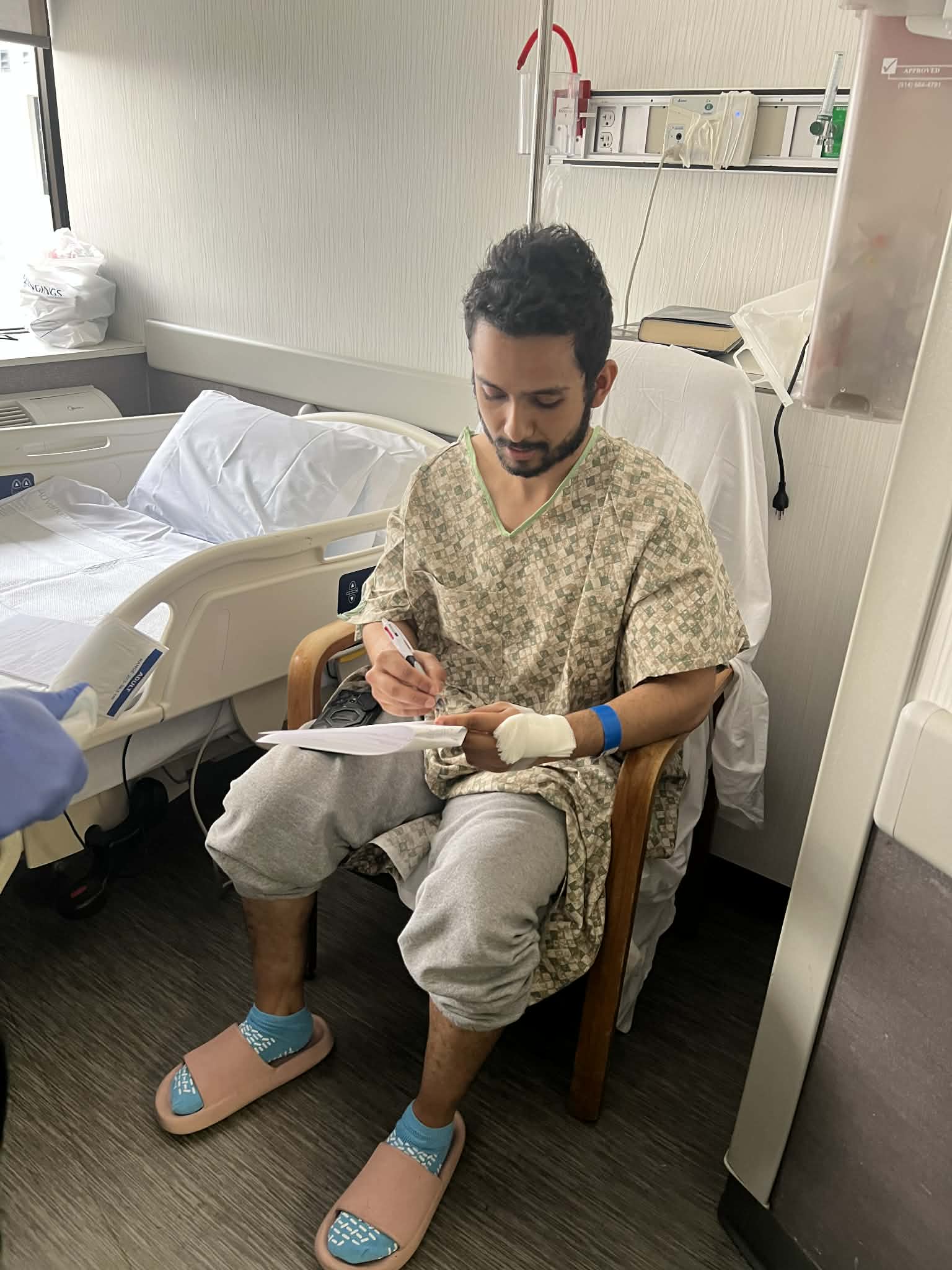 Ashish signing discharge papers